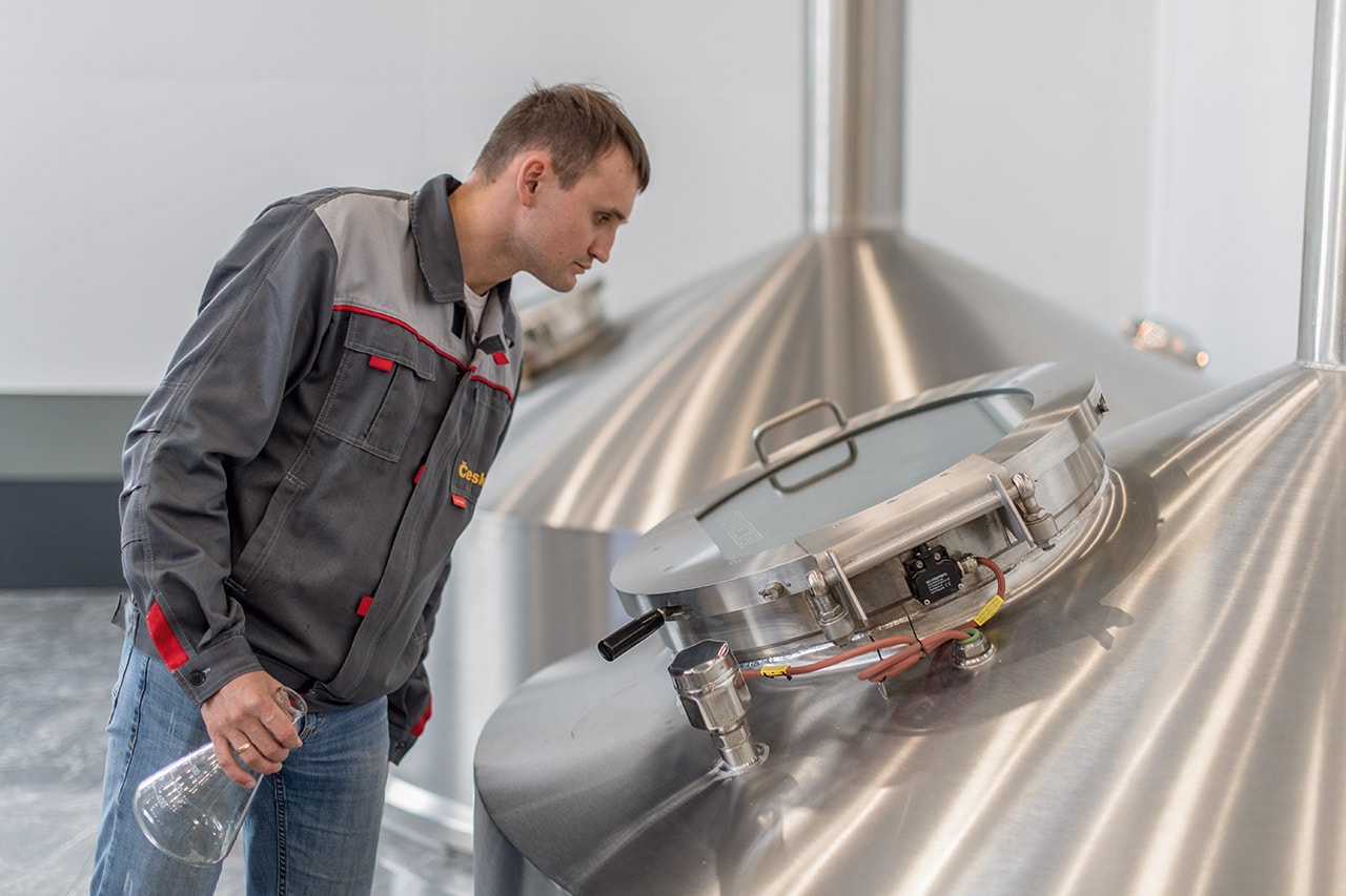 An operator monitors the mashing process. 